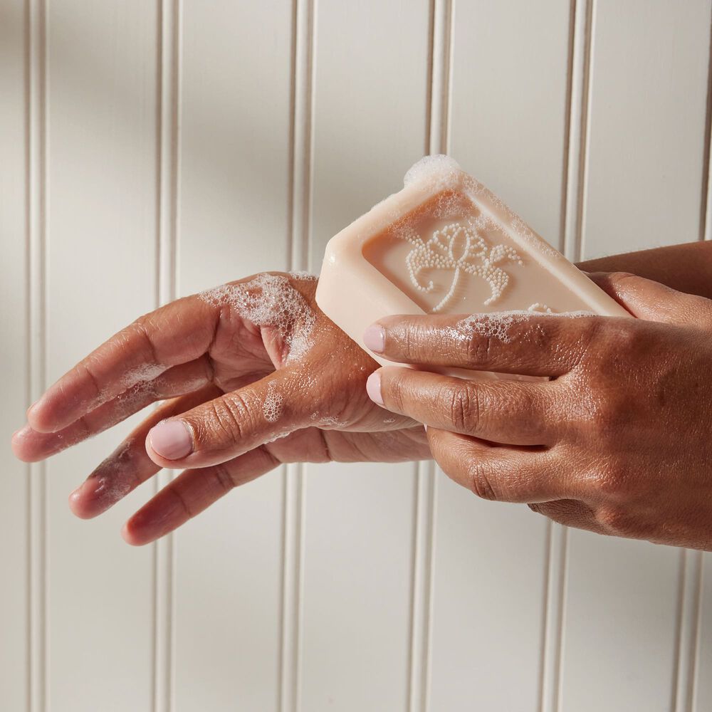 Thymes Kimono Rose Bar Soap being applied to hand image number 2